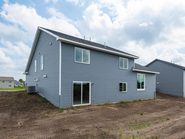 back of property featuring central AC unit