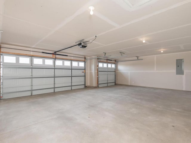 garage with electric panel and a garage door opener