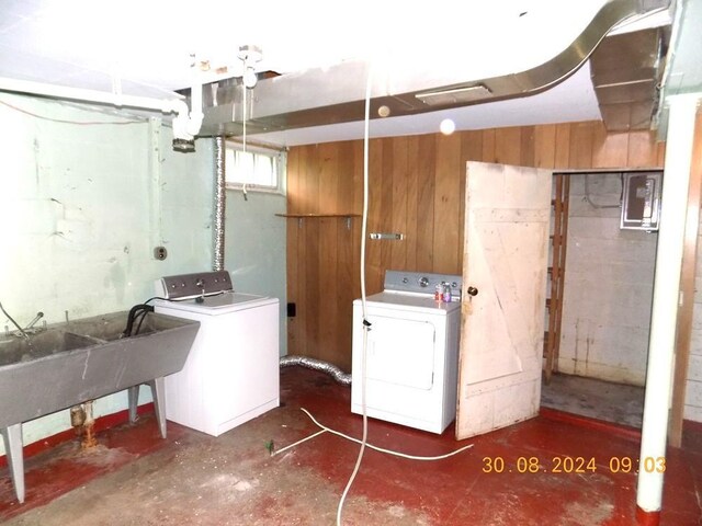 basement featuring wood walls and sink