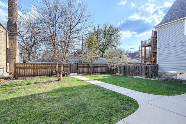 view of yard with a balcony