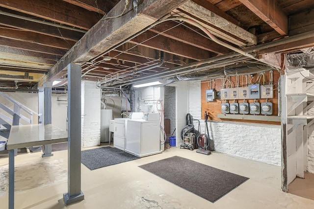 basement with washing machine and dryer and water heater