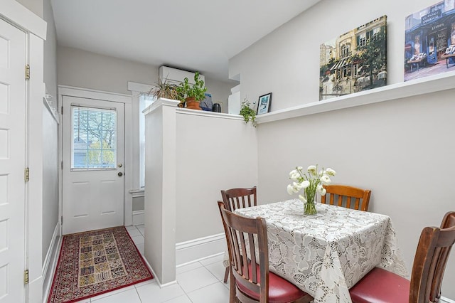 dining space with light tile patterned floors