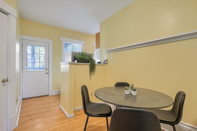 dining space featuring light hardwood / wood-style floors