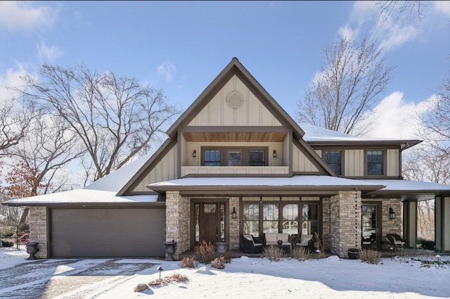 view of front facade with a porch and a garage