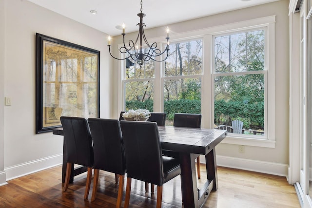 dining room featuring a notable chandelier and light hardwood / wood-style floors