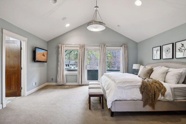 bedroom featuring carpet floors and vaulted ceiling