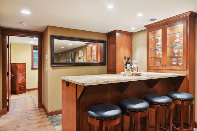 bar featuring light stone counters