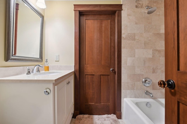 bathroom with vanity and tiled shower / bath