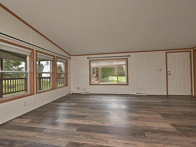27602 County Road 51, Bovey, MN 55709 - unfurnished room with wood finished floors, visible vents, ornamental molding, and vaulted ceiling
