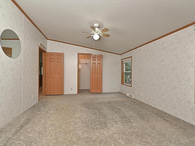 27602 County Road 51, Bovey, MN 55709 - carpeted empty room featuring visible vents, a textured ceiling, a ceiling fan, and crown molding