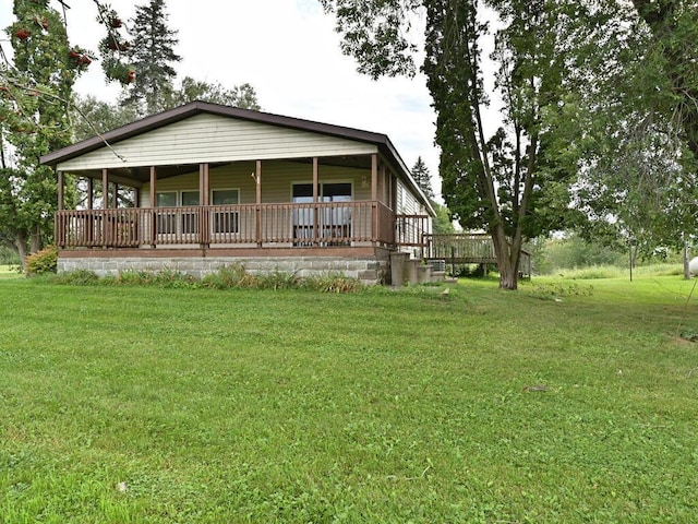27602 County Road 51, Bovey, MN 55709 - back of house with a lawn and covered porch