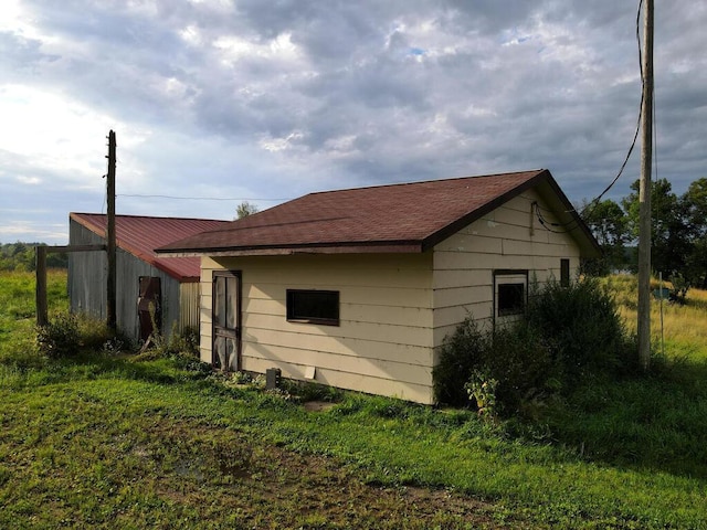 27602 County Road 51, Bovey, MN 55709 - view of home's exterior featuring a shingled roof