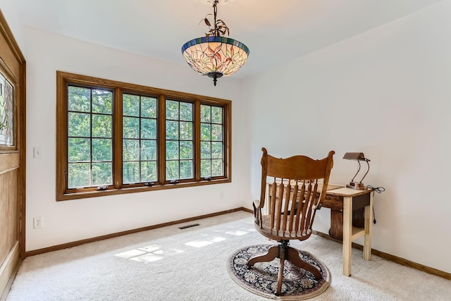 living area with light colored carpet