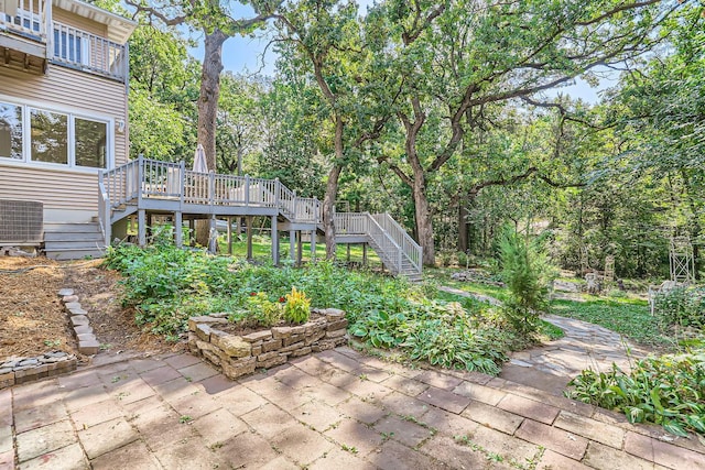 view of patio with central AC and a deck