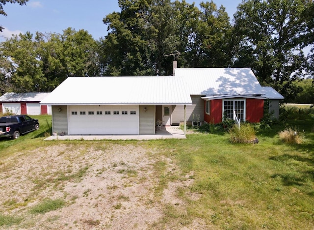 ranch-style house with a front yard, an attached garage, a chimney, and dirt driveway