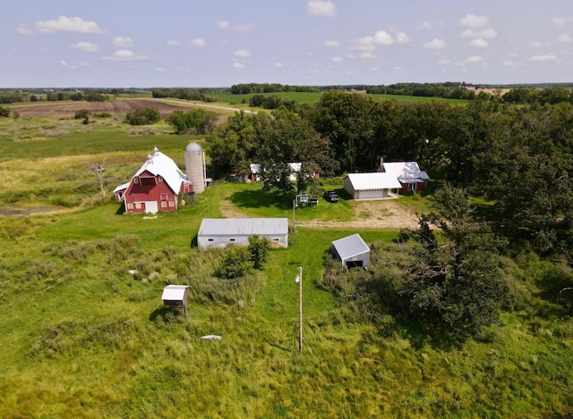 birds eye view of property with a rural view