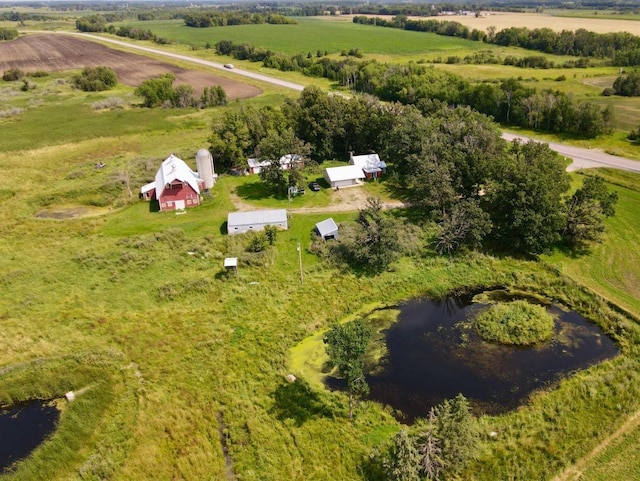 drone / aerial view with a water view and a rural view