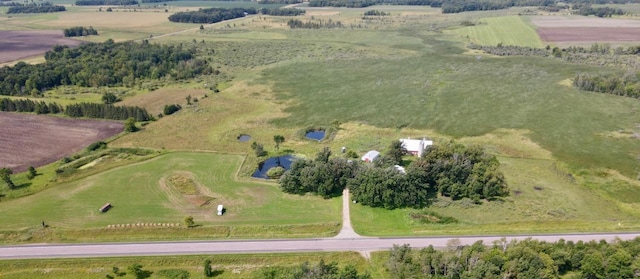 birds eye view of property featuring a rural view