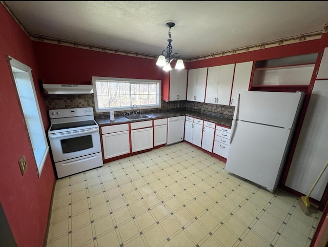 kitchen featuring a notable chandelier, white cabinetry, white appliances, backsplash, and sink