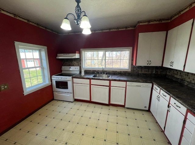 kitchen featuring an inviting chandelier, white appliances, white cabinets, and tasteful backsplash