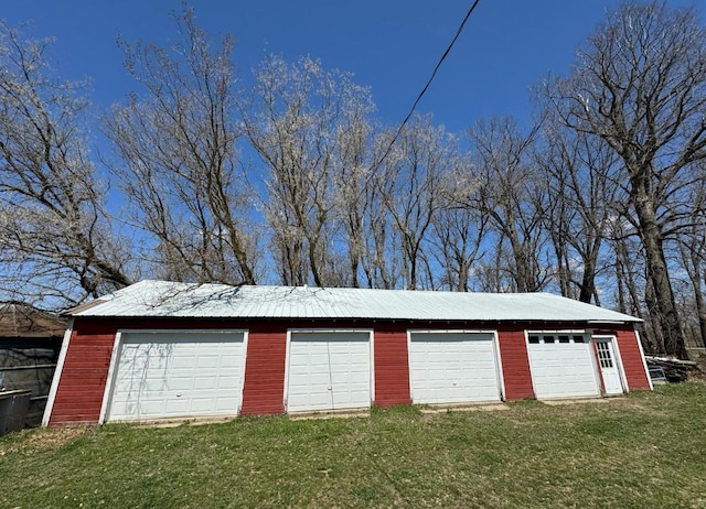 garage featuring a yard