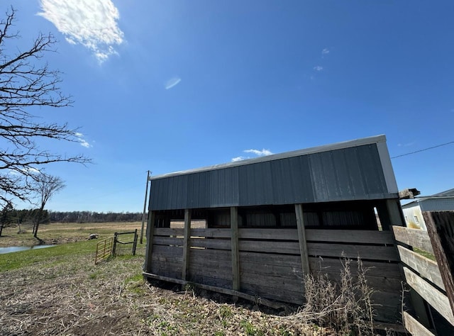 view of outbuilding with a rural view