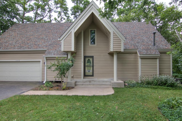 view of front of house with a garage and a front lawn