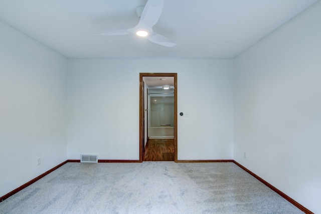 empty room featuring ceiling fan and carpet flooring