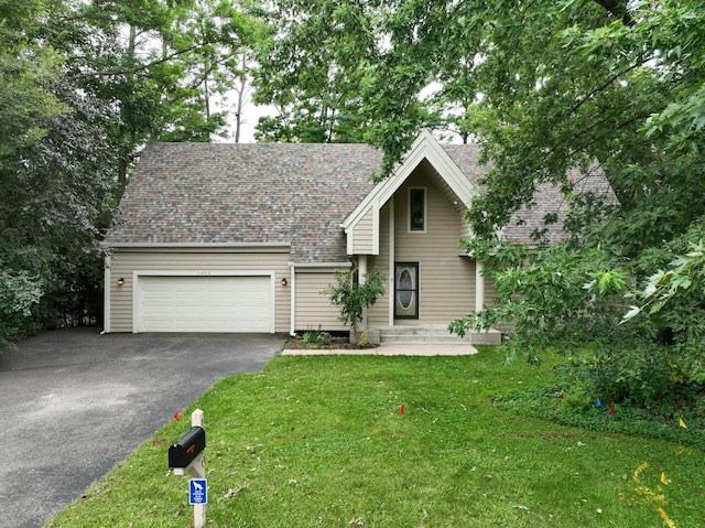 view of front of home featuring a garage and a front yard