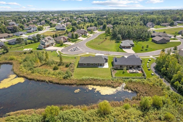 birds eye view of property featuring a residential view and a water view