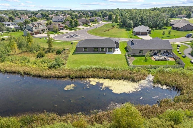 bird's eye view with a residential view and a water view