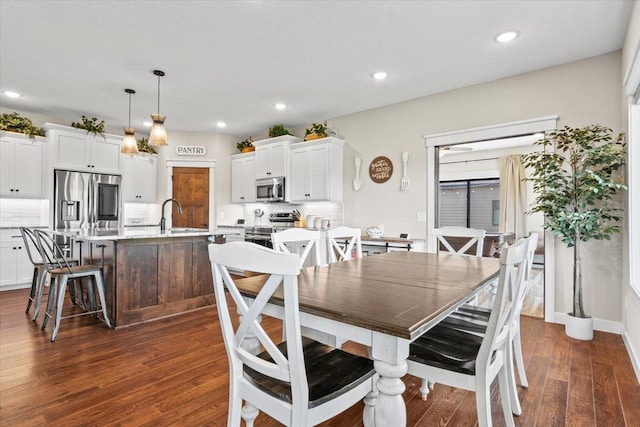 dining space with recessed lighting and dark wood-style floors