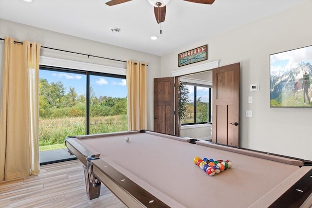 rec room with light wood-style flooring, pool table, and a ceiling fan