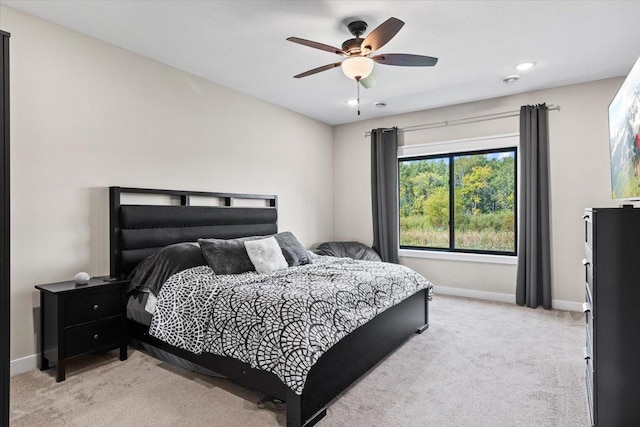 bedroom featuring light carpet, recessed lighting, ceiling fan, and baseboards