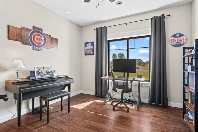 office space with visible vents, a ceiling fan, baseboards, and wood finished floors