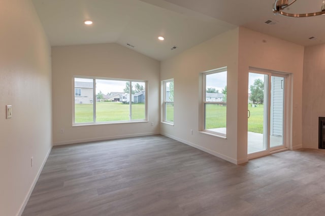 interior space with vaulted ceiling and hardwood / wood-style floors