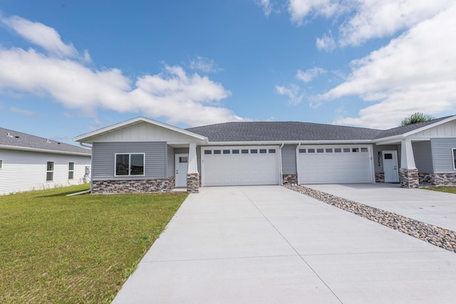 view of front of property featuring a garage and a front yard