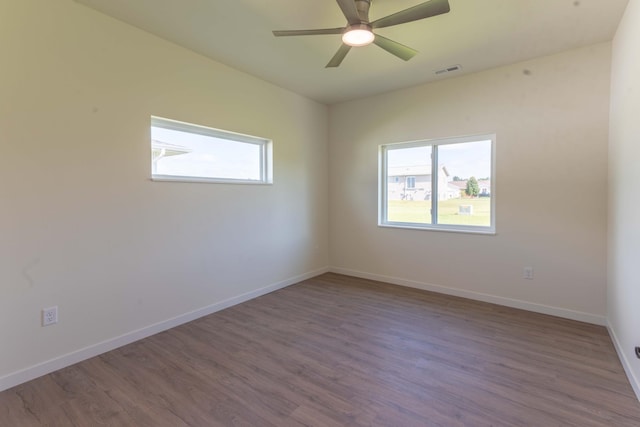 spare room with wood-type flooring and ceiling fan