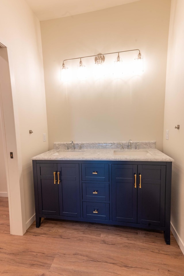 bathroom featuring vanity and hardwood / wood-style flooring