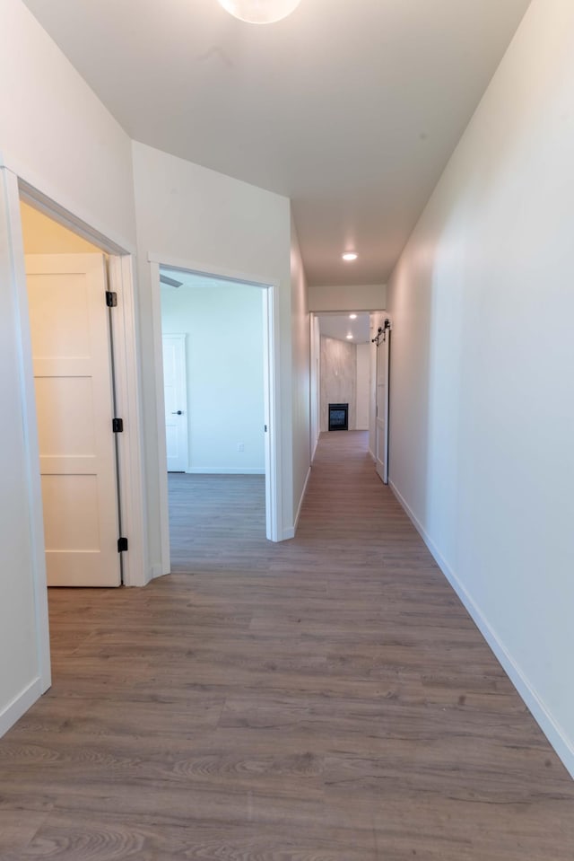 hall with dark hardwood / wood-style flooring