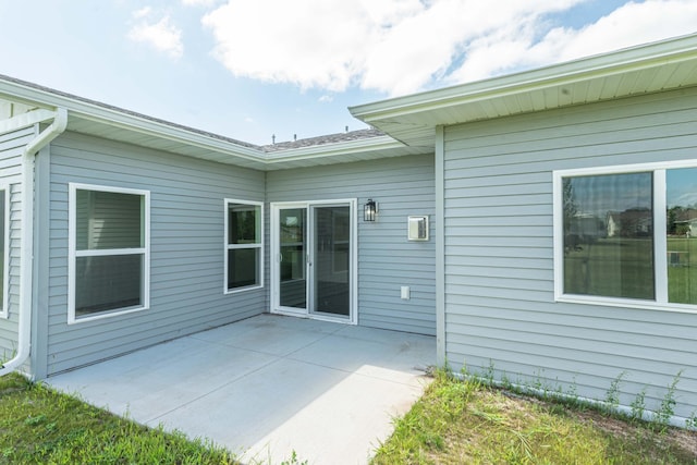 rear view of property featuring a patio area