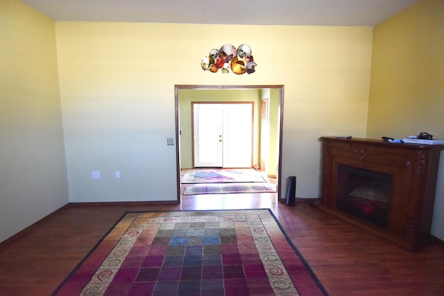102 6th St SW, Red Lake Falls, MN 56750 - entryway with wood finished floors, baseboards, and a glass covered fireplace