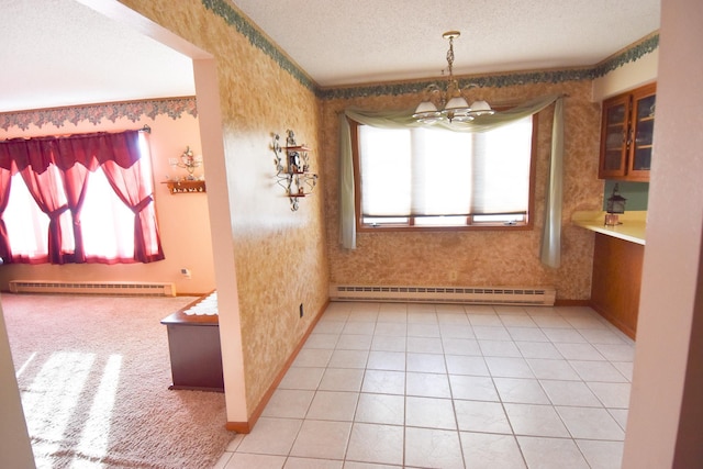 102 6th St SW, Red Lake Falls, MN 56750 - unfurnished dining area with a baseboard radiator, baseboard heating, wallpapered walls, a chandelier, and baseboards