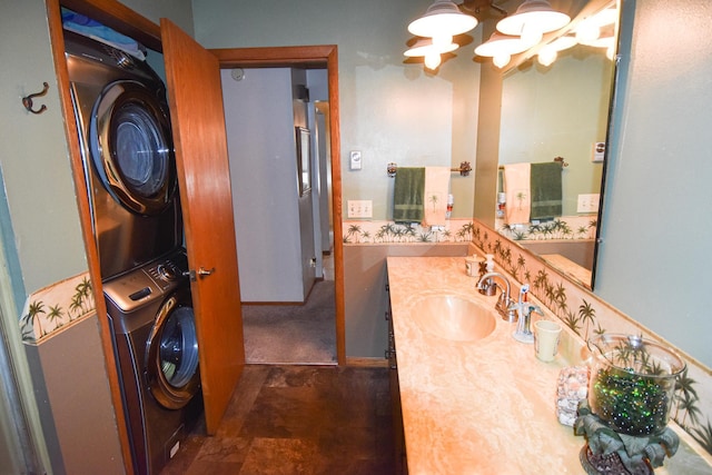 102 6th St SW, Red Lake Falls, MN 56750 - bathroom with estacked washer and dryer, a chandelier, and vanity