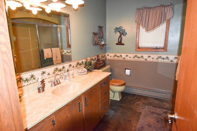 102 6th St SW, Red Lake Falls, MN 56750 - full bath with a baseboard radiator, a wainscoted wall, a stall shower, vanity, and toilet