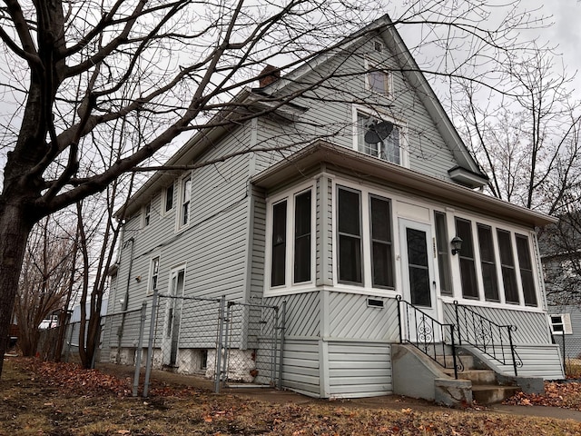 view of side of property with a sunroom