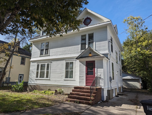 view of front of house featuring an outbuilding