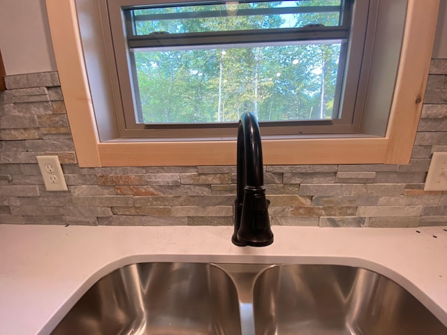 3450 23rd Ave NW, Hackensack, MN 56452 - kitchen view of a sink, light countertops, and backsplash