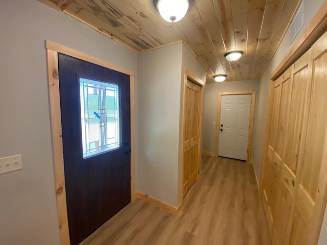 3450 23rd Ave NW, Hackensack, MN 56452 - foyer entrance featuring light wood-type flooring, wood ceiling, and baseboards