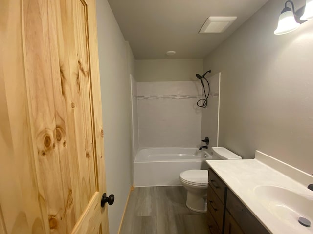 3450 23rd Ave NW, Hackensack, MN 56452 - bathroom featuring wood finished floors, vanity, toilet, and shower / washtub combination
